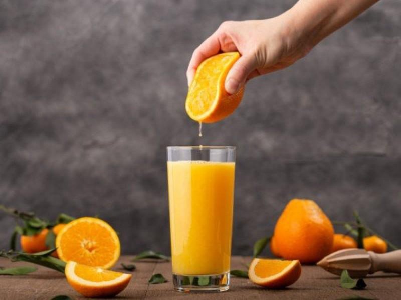 uống nước cam có trị mụn không